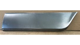 A new sheet metal car panel; it is gray, rectangular with a curved corner, and lies on cardboard.