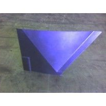 Blue, triangular object with a small rectangular attachment, possibly a metal part, on a gray surface.
