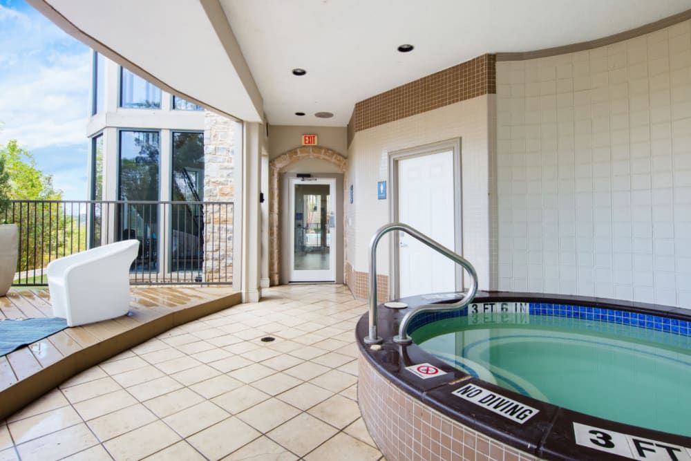 A hot tub with a covered top at Marquis at Treetops in Northwest Austin, TX.