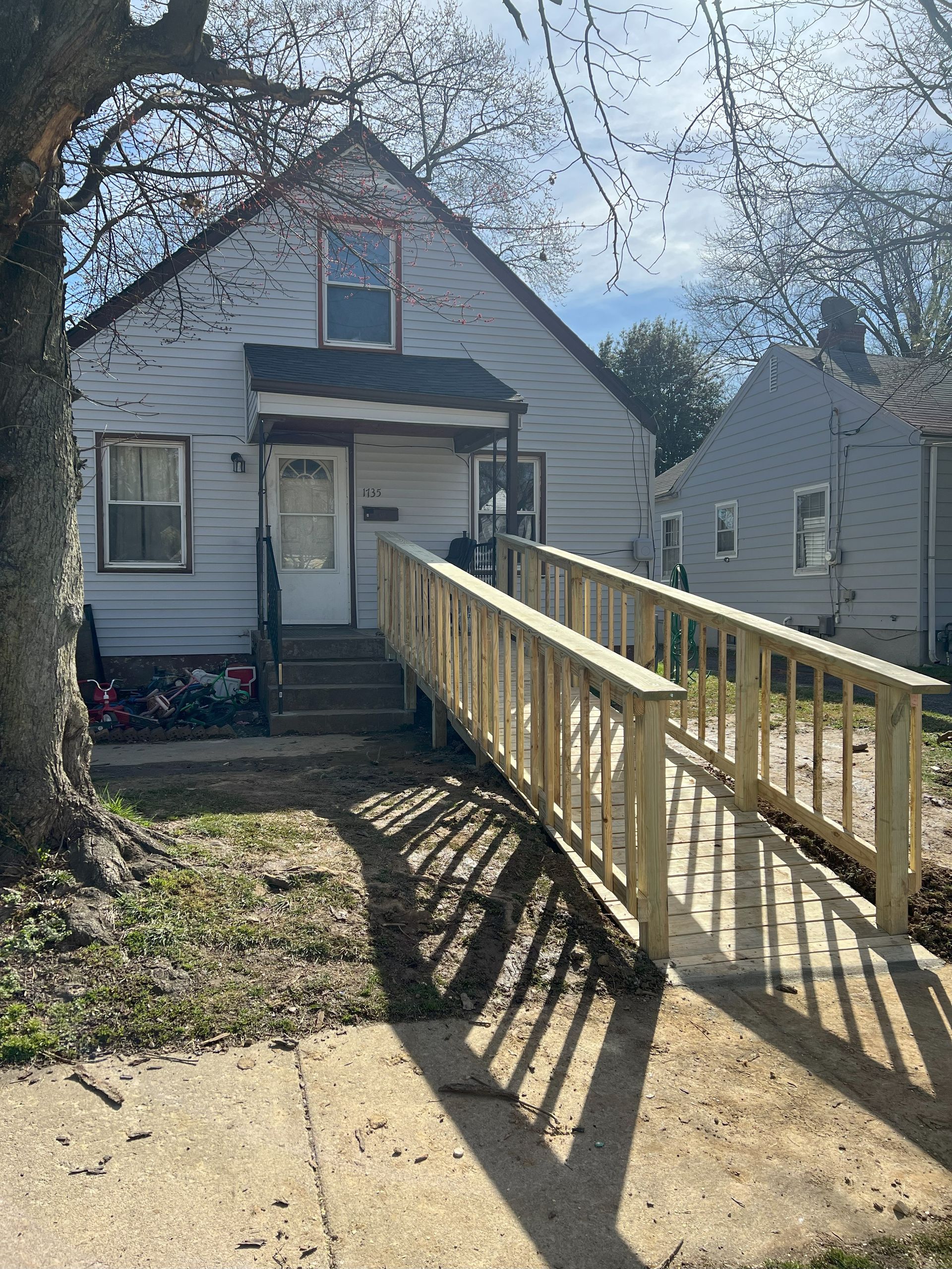 A house with a ramp leading to the front door.