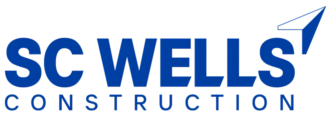Two construction workers are talking to each other in a building under construction.