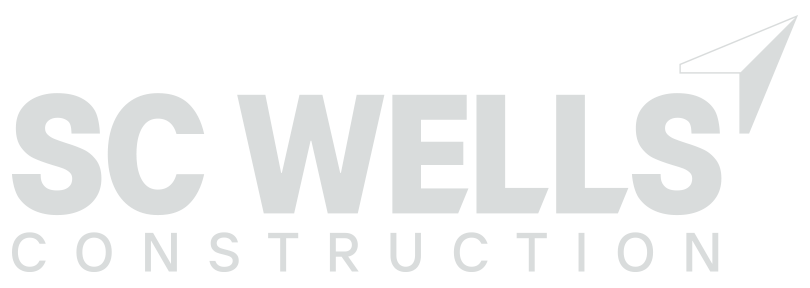 The logo for sc wells construction is gray and white