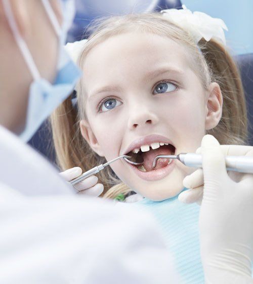Special needs child receiving dental treatment in West Seneca, NY