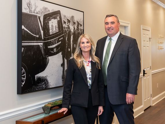 The owners standing together at Frederick location