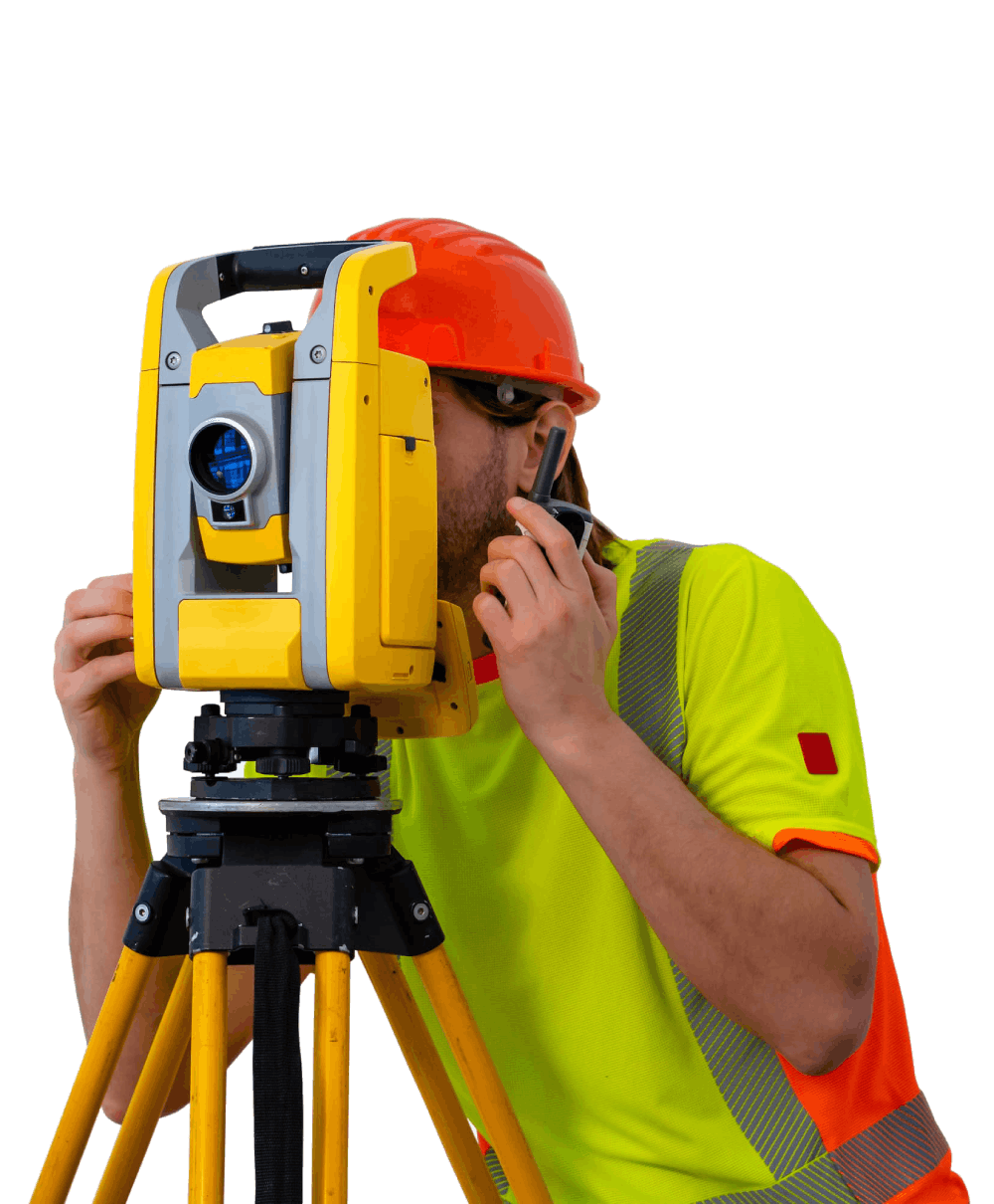 Surveyor using a yellow and black theodolite on a tripod.