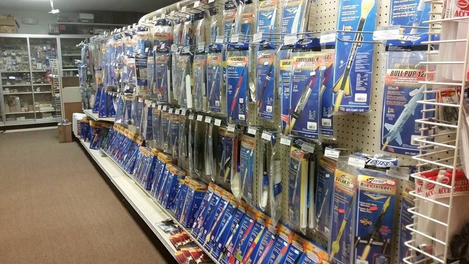 A store aisle filled with lots of toys including airplanes