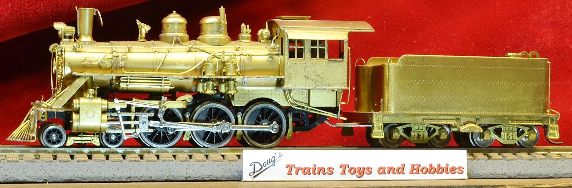 A model train with a sign that says trains toys and hobbies