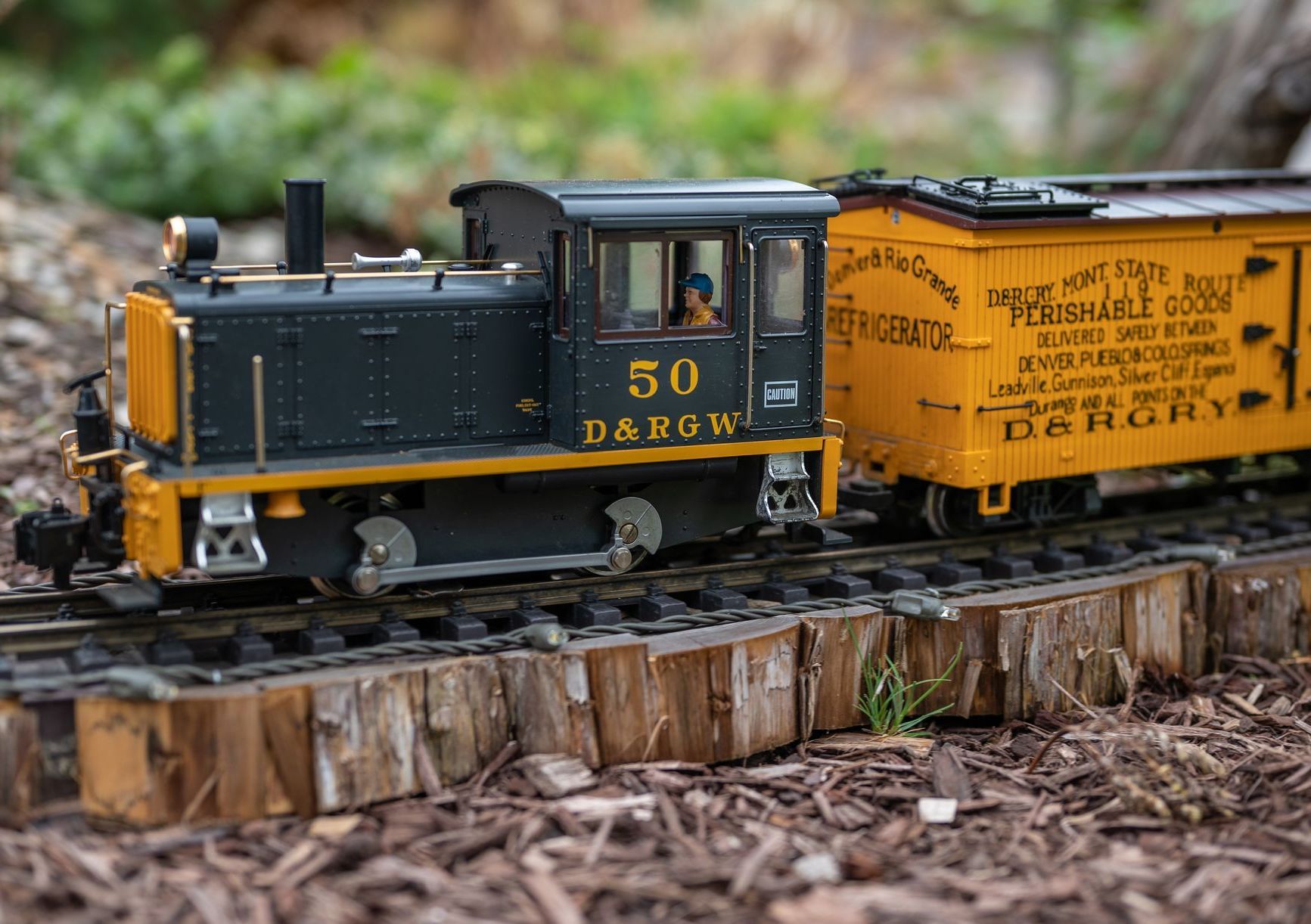 A display case filled with a variety of toy trains.