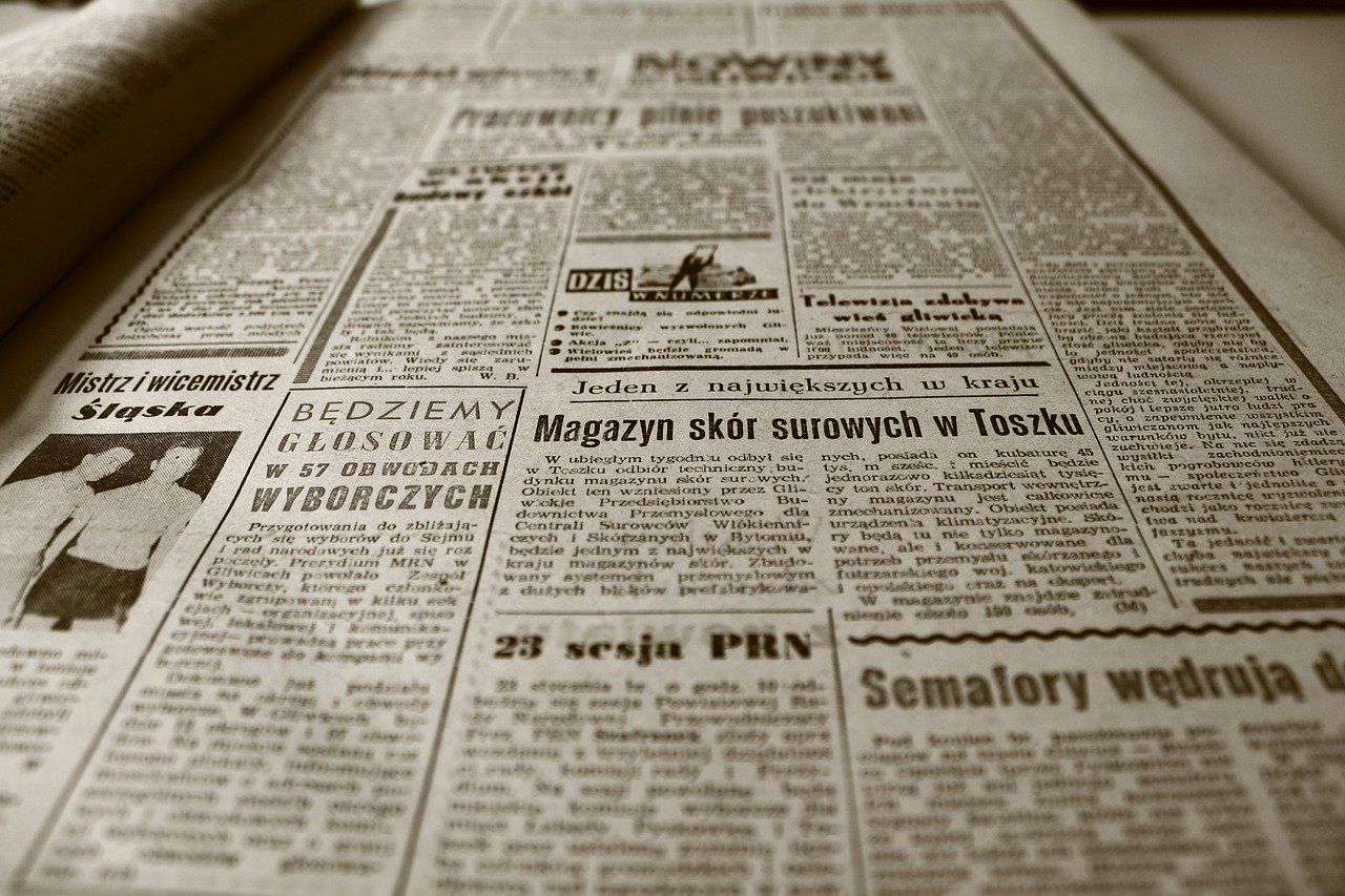 A newspaper is open to a page that says semafory