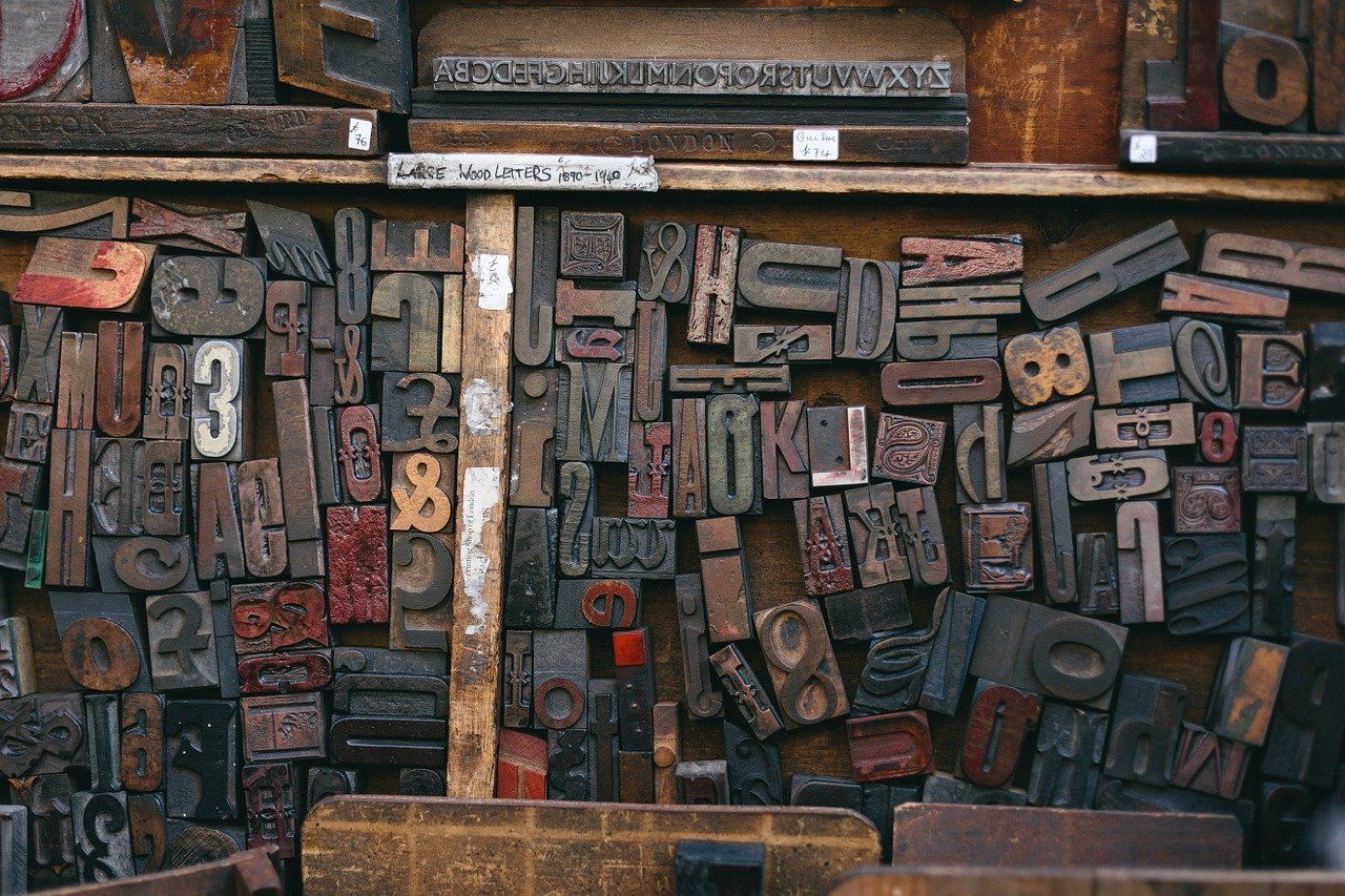 There are many different types of letters and numbers on the wall.