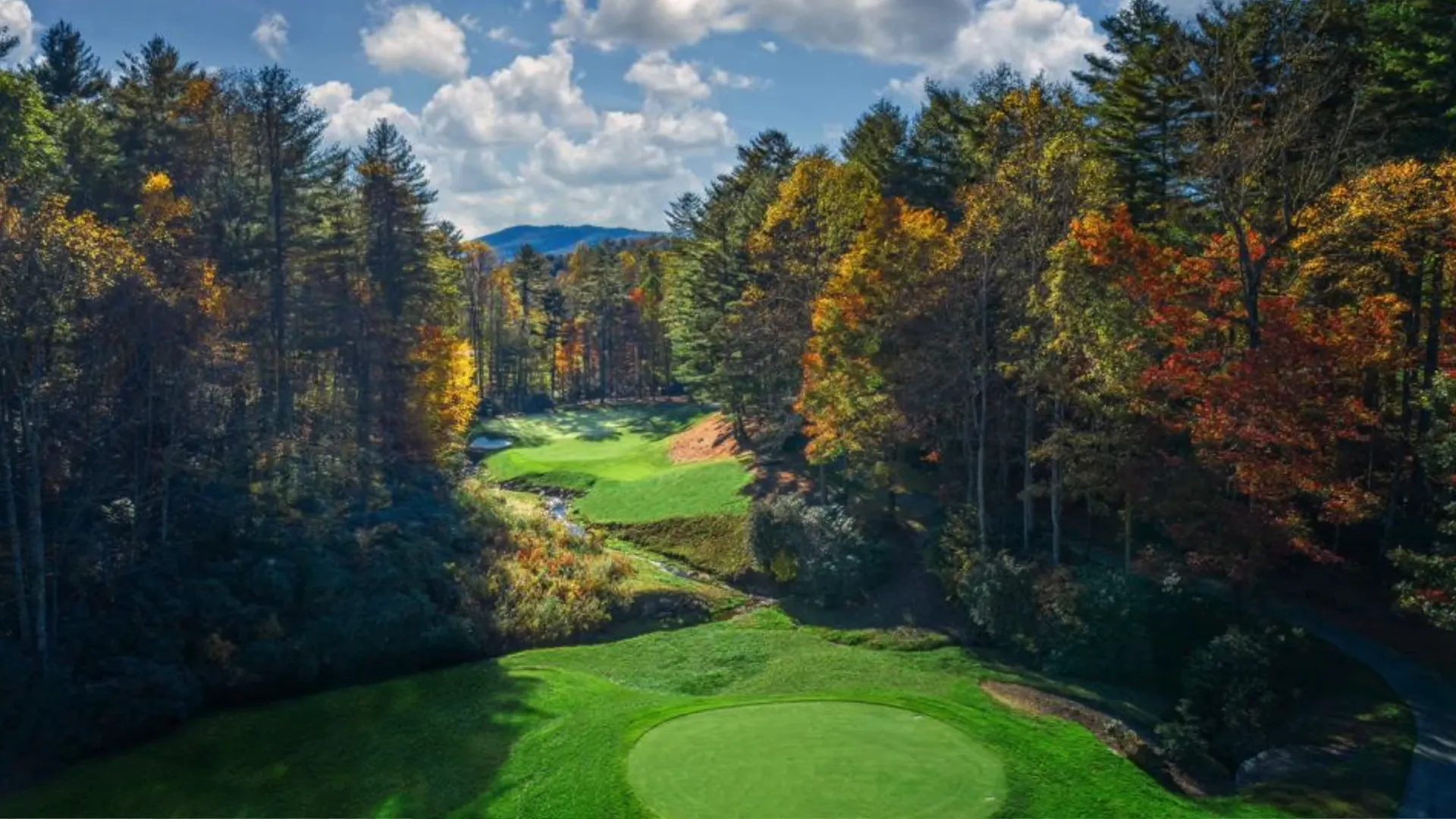 An aerial view showcasing the scenic beauty of Hendersonville, NC, nestled in the Blue Ridge Mountai