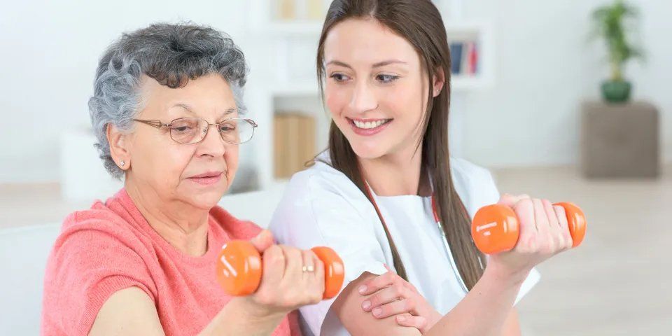 Old Woman Doing Exercise With Her Caregiver — Brooklyn, NY — Safe Haven Home Care