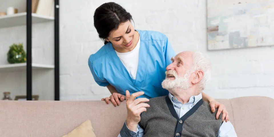Old Man and Caregiver Looking on Each Other — Brooklyn, NY — Safe Haven Home Care