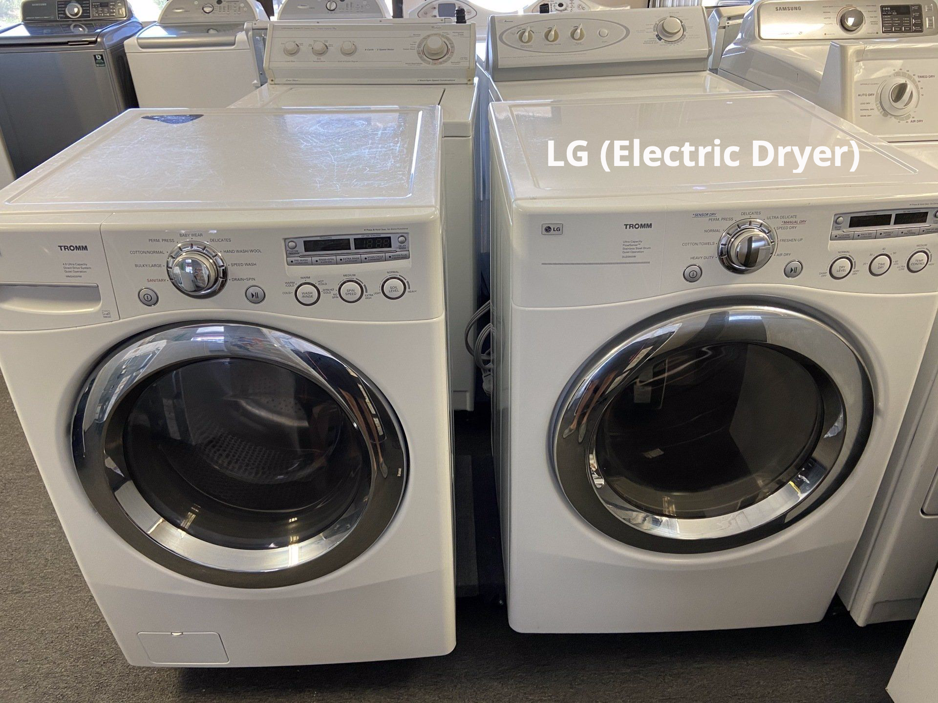 A washer and dryer are sitting next to each other in a store.