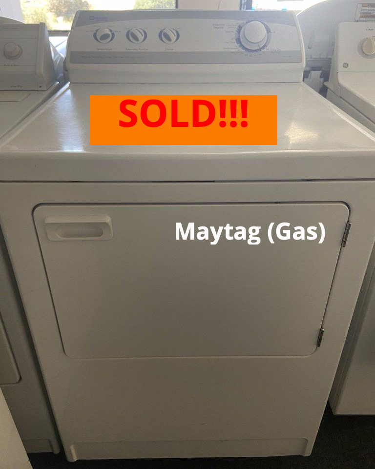 A white dryer with a sold sign on it
