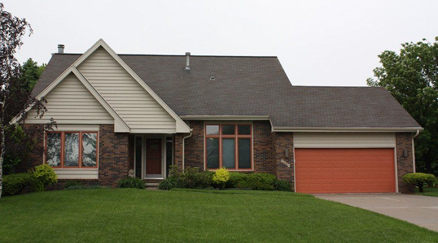 Brown Brick House — Waukee, IA — Allstate Gutter & Siding
