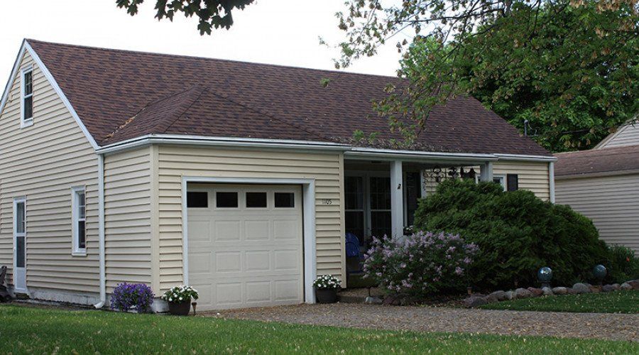 House with Yellow Siding — Waukee, IA — Allstate Gutter & Siding