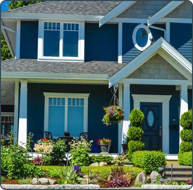 Blue House with Garden — Waukee, IA — Allstate Gutter & Siding