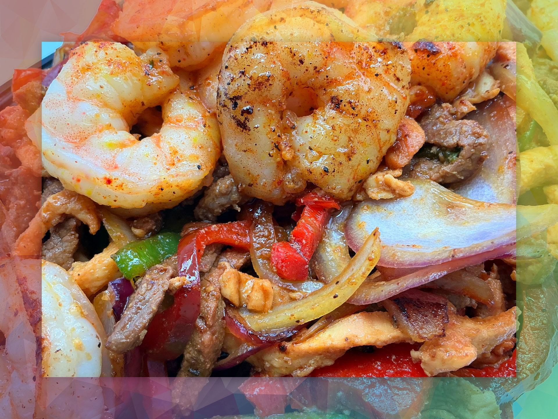 Grilled shrimp with peppers, onions, and meat.