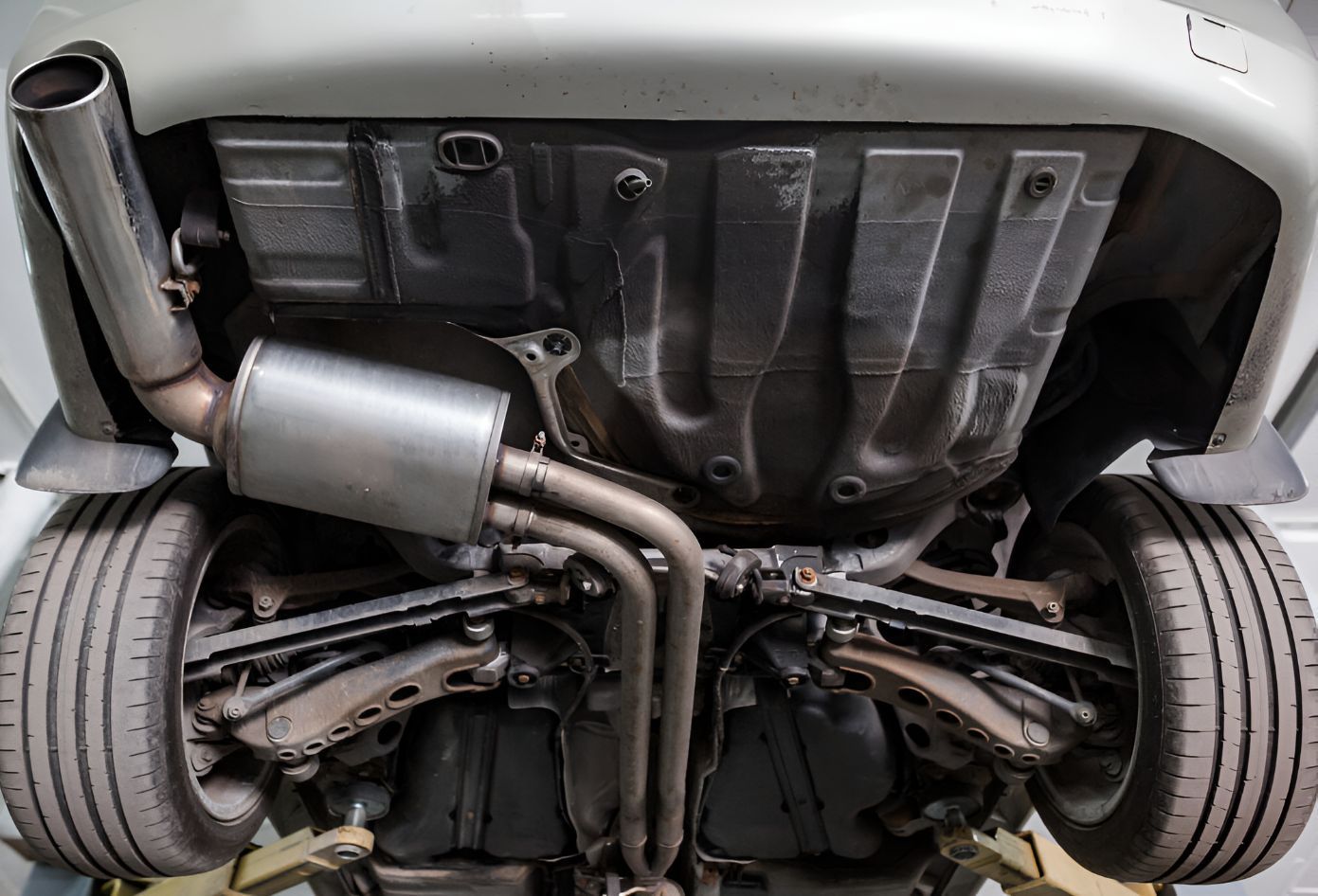A Close Up of the Underside of a Car With a Exhaust Pipe — K & T Ballina Mechanical In Ballina, NSW