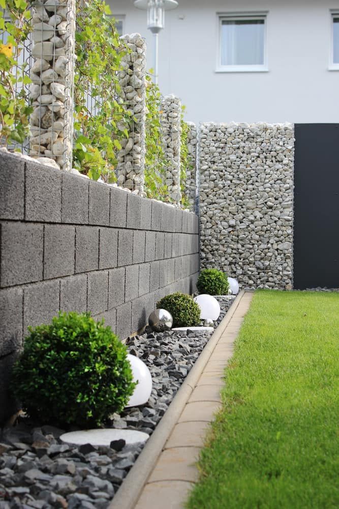 Modern Garden With Stone Wall — Brett Continuous Concrete Kerbing & Edging In Lake Cathie, NSW