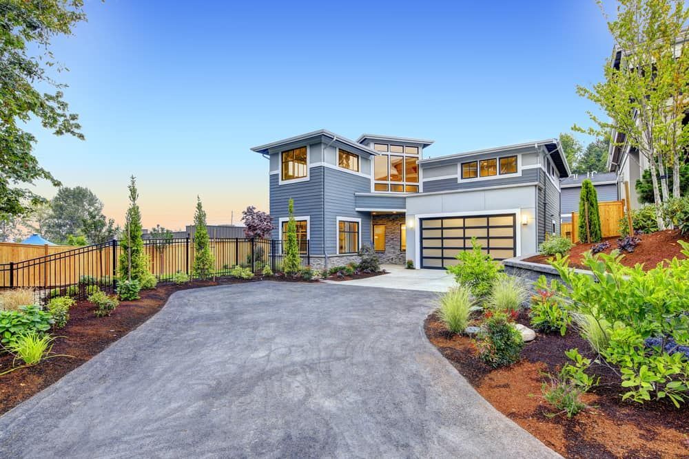 Modern Two-storey House With Large Windows — Brett Continuous Concrete Kerbing & Edging In Lake Cathie, NSW