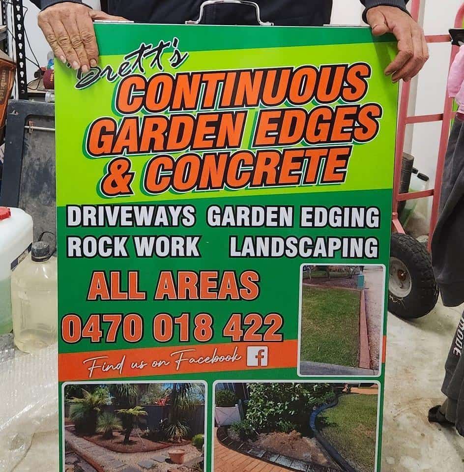 Advertisement Sign With Bold Orange and White Text — Brett Continuous Concrete Kerbing & Edging In Lakewood, NSW