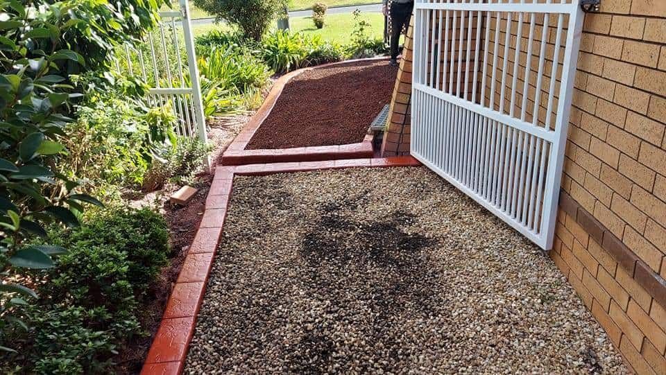 Gravel Path With Brick Edging Leads to White Metal Gate — Brett Continuous Concrete Kerbing & Edging In North Haven, NSW