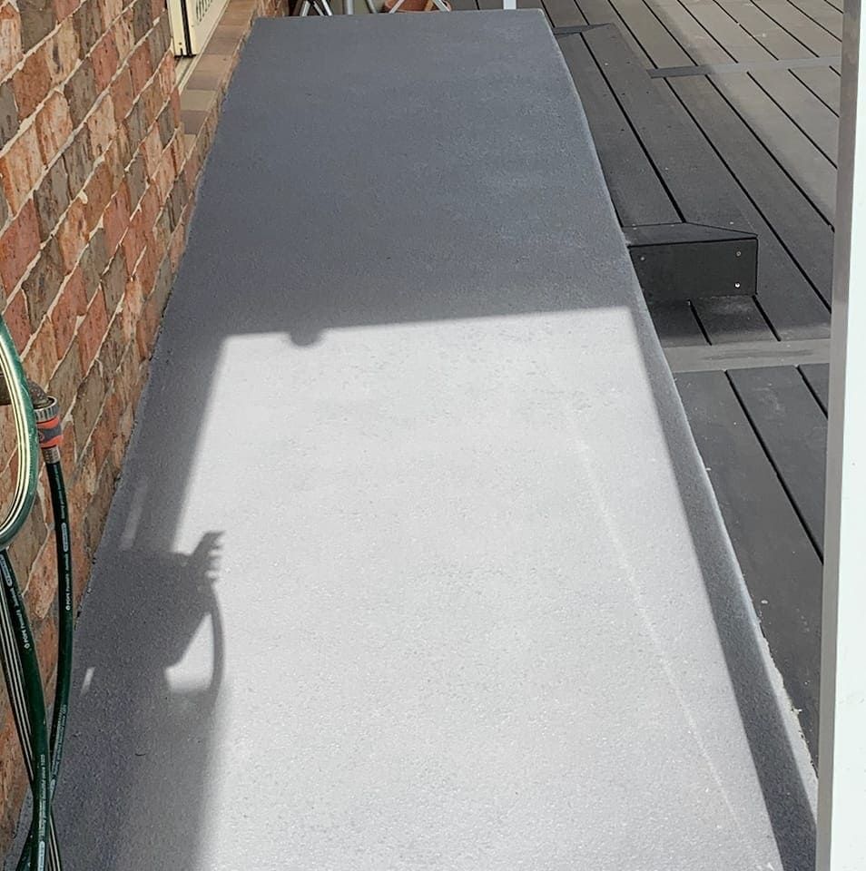 Shadow of an Antenna Cast on a Light Grey Terrace — Brett Continuous Concrete Kerbing & Edging In North Haven, NSW