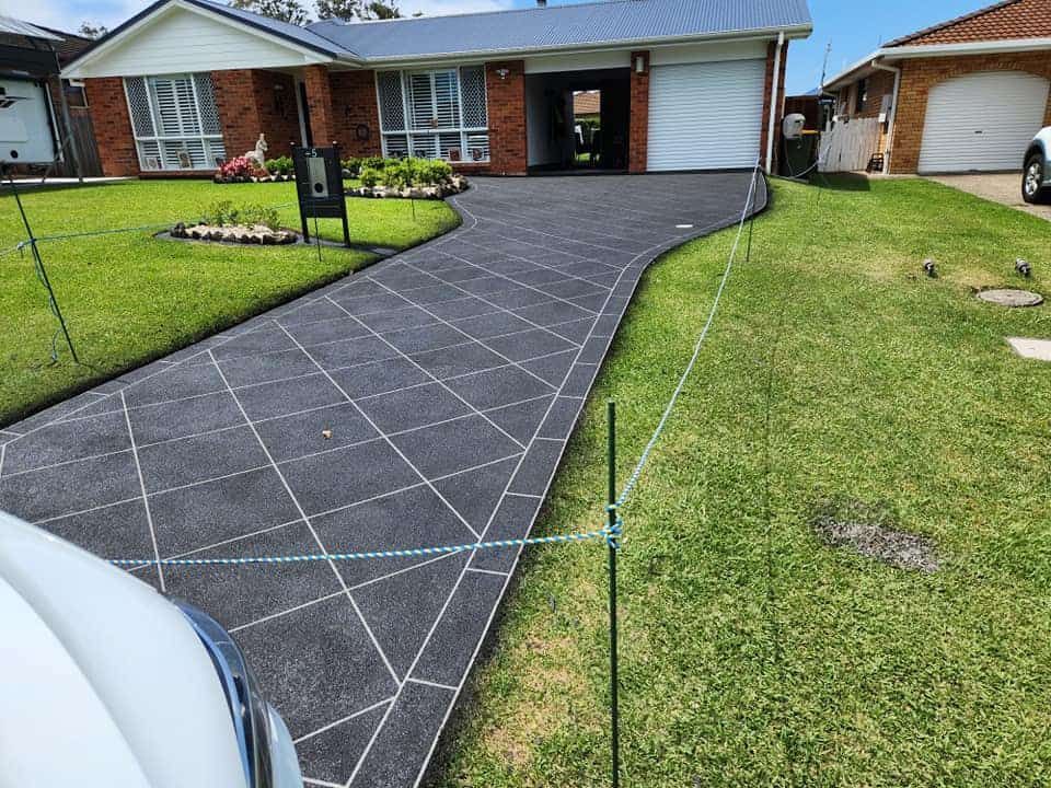 Freshly Paved Driveway With a Grid Pattern — Brett Continuous Concrete Kerbing & Edging In Lakewood, NSW
