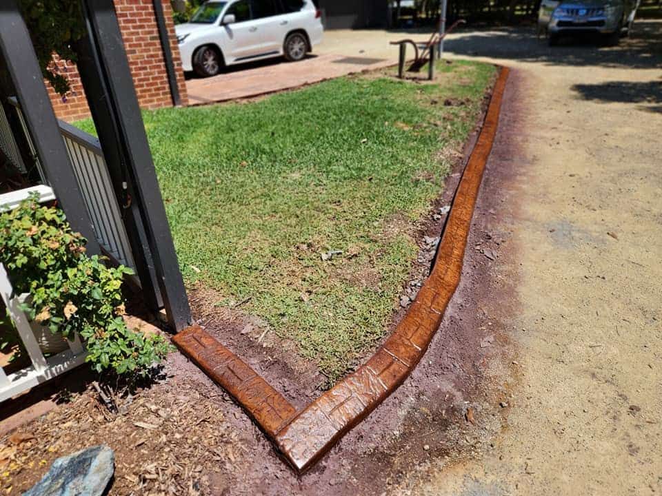 Red Brick Garden Edging — Brett Continuous Concrete Kerbing & Edging In Lakewood, NSW