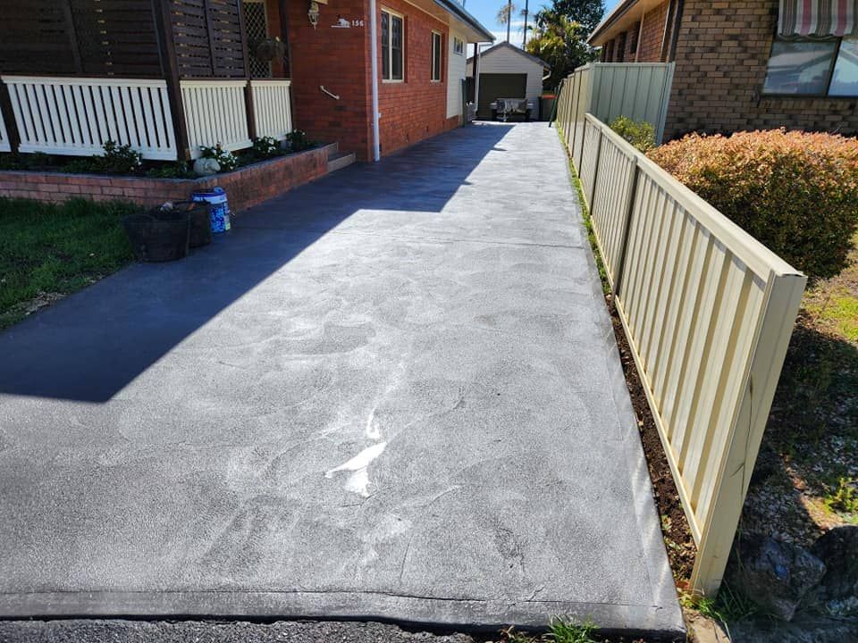 A Newly-paved Concrete Driveway — Brett Continuous Concrete Kerbing & Edging In Lakewood, NSW