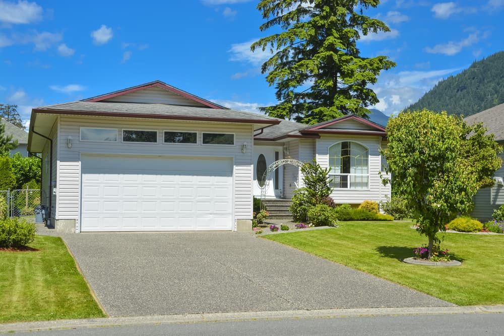 Suburban Home With a White Facade — Brett Continuous Concrete Kerbing & Edging In Wauchope, NSW
