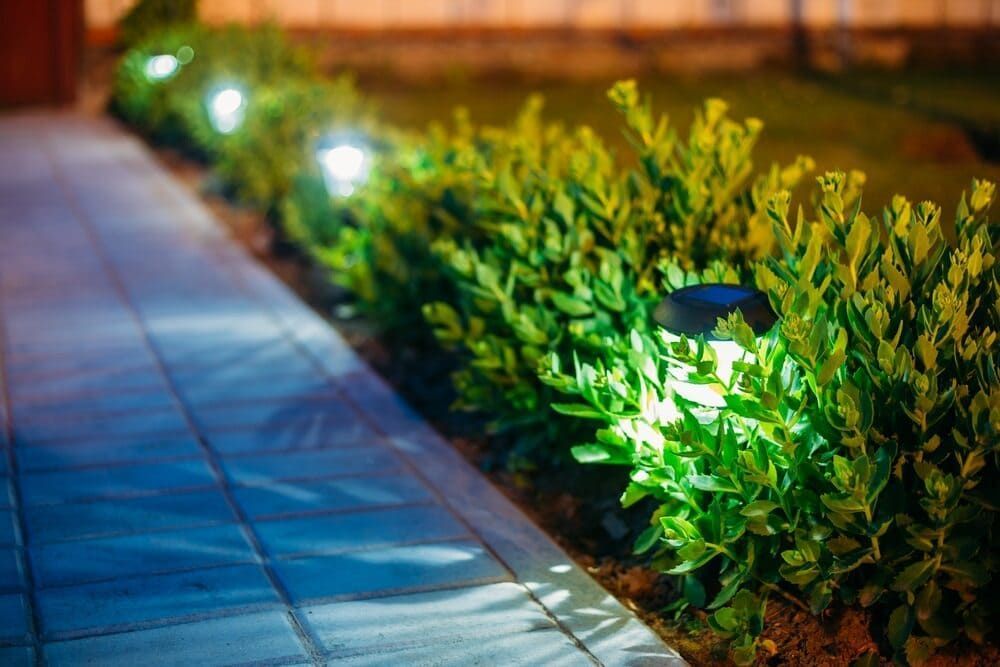 A Path Lit by Small Solar Lights — Brett Continuous Concrete Kerbing & Edging In Wauchope, NSW