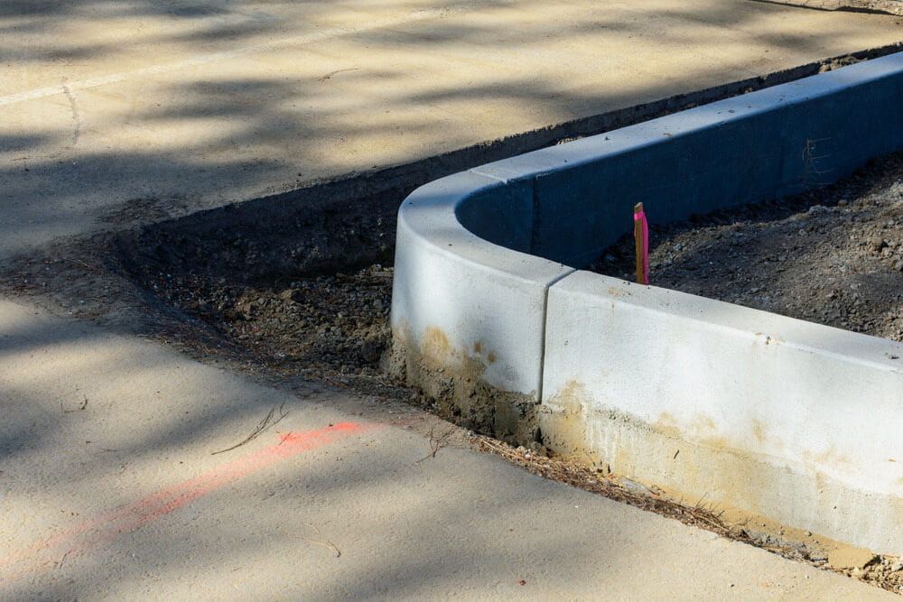 Concrete Kerb Construction Site With Exposed Soil — Brett Continuous Concrete Kerbing & Edging In Lakewood, NSW