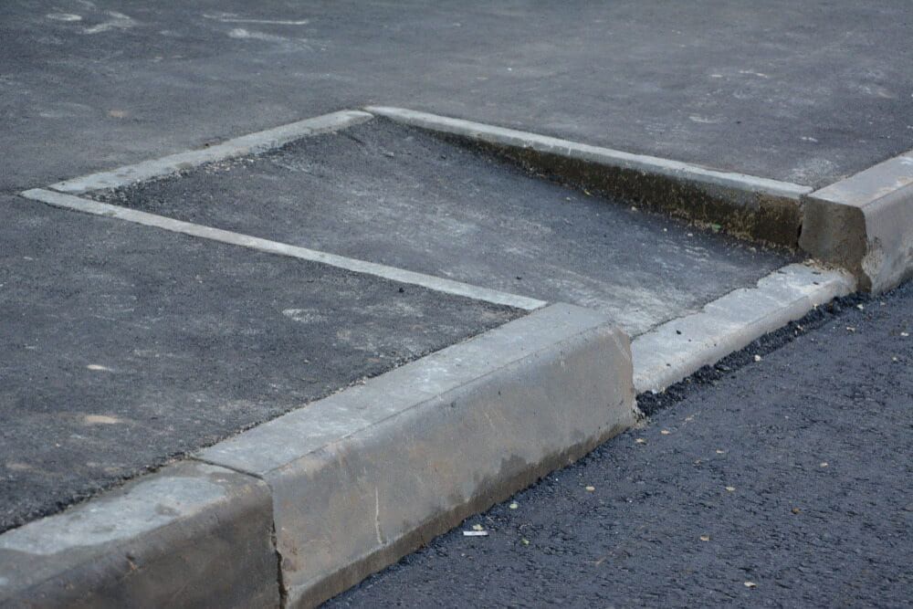 Concrete Ramp Bordered by a Kerb — Brett Continuous Concrete Kerbing & Edging In Lakewood, NSW