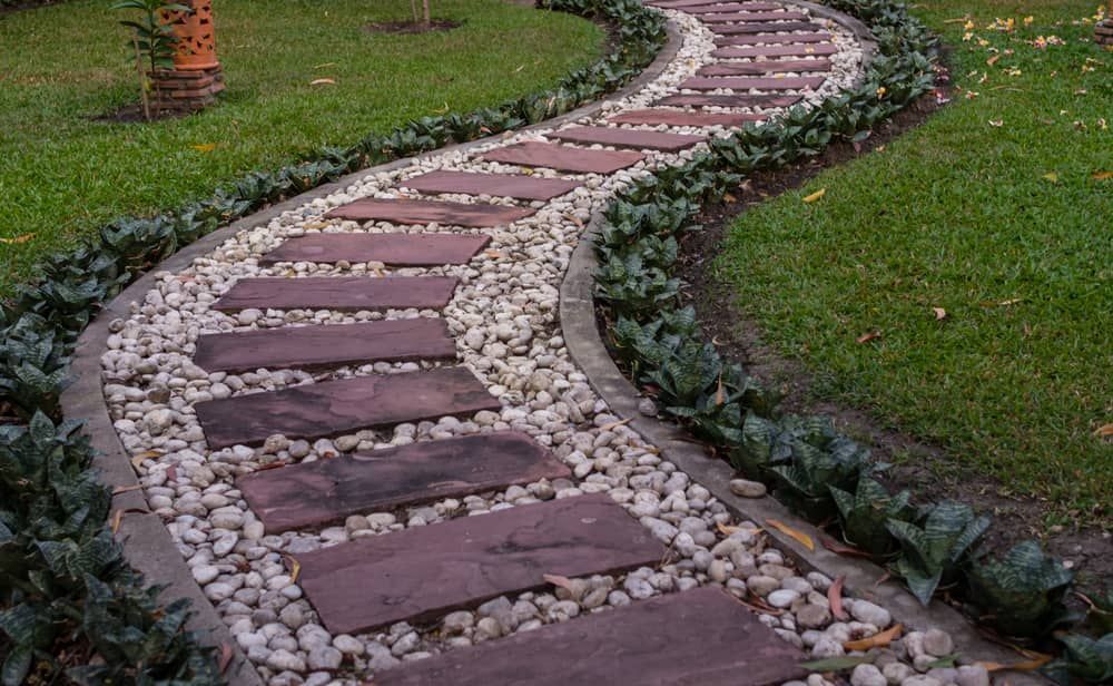 Curved Garden Path With Red Stepping Stones — Brett Continuous Concrete Kerbing & Edging In Laurieton, NSW