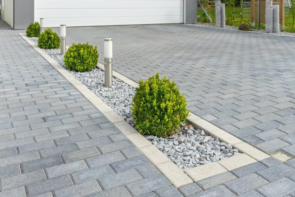 Modern Driveway With Light Grey Interlocking Pavers — Brett Continuous Concrete Kerbing & Edging In Lakewood, NSW