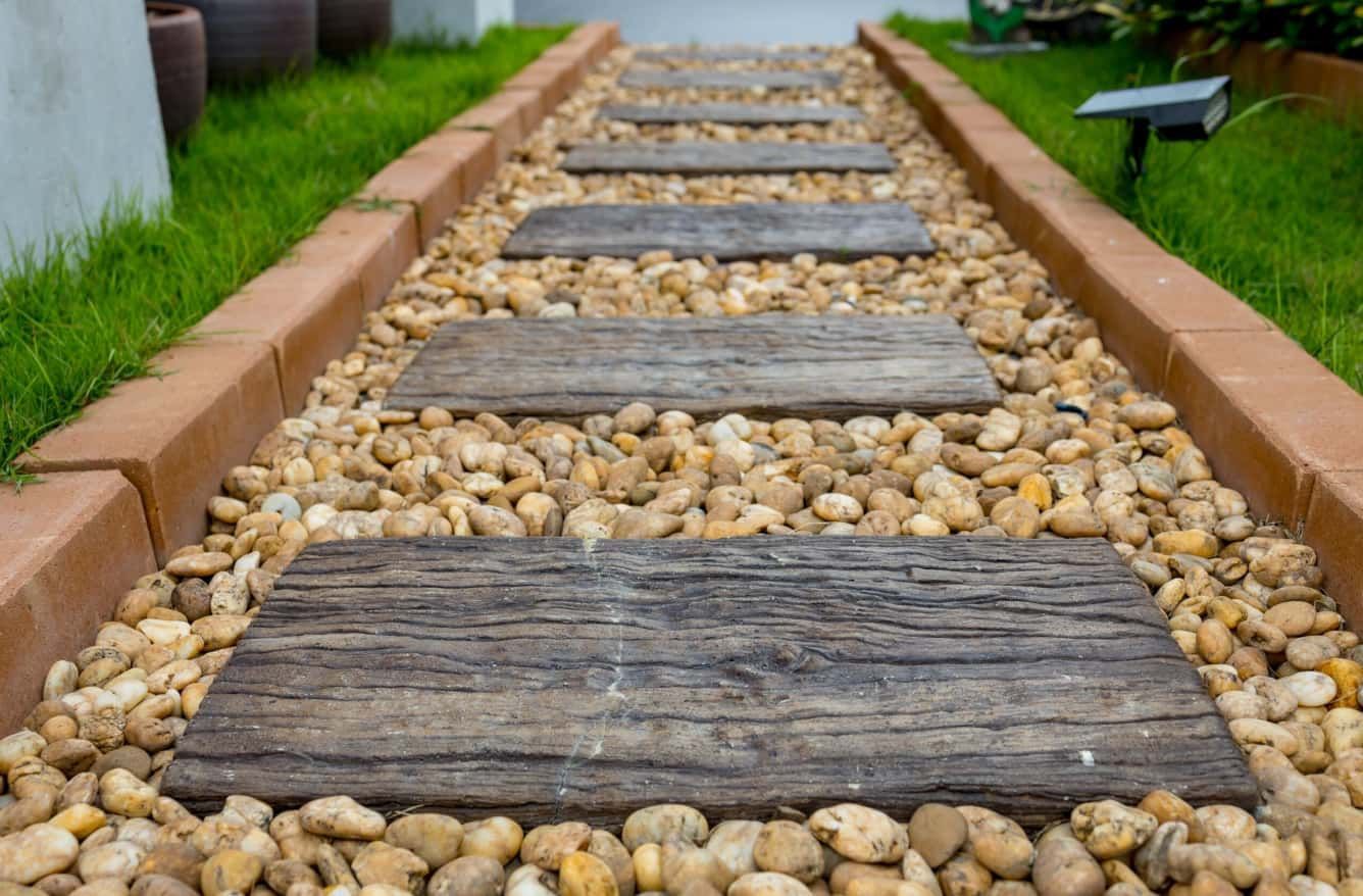 Stone Path Bordered by Brick Edges — Brett Continuous Concrete Kerbing & Edging In Laurieton, NSW