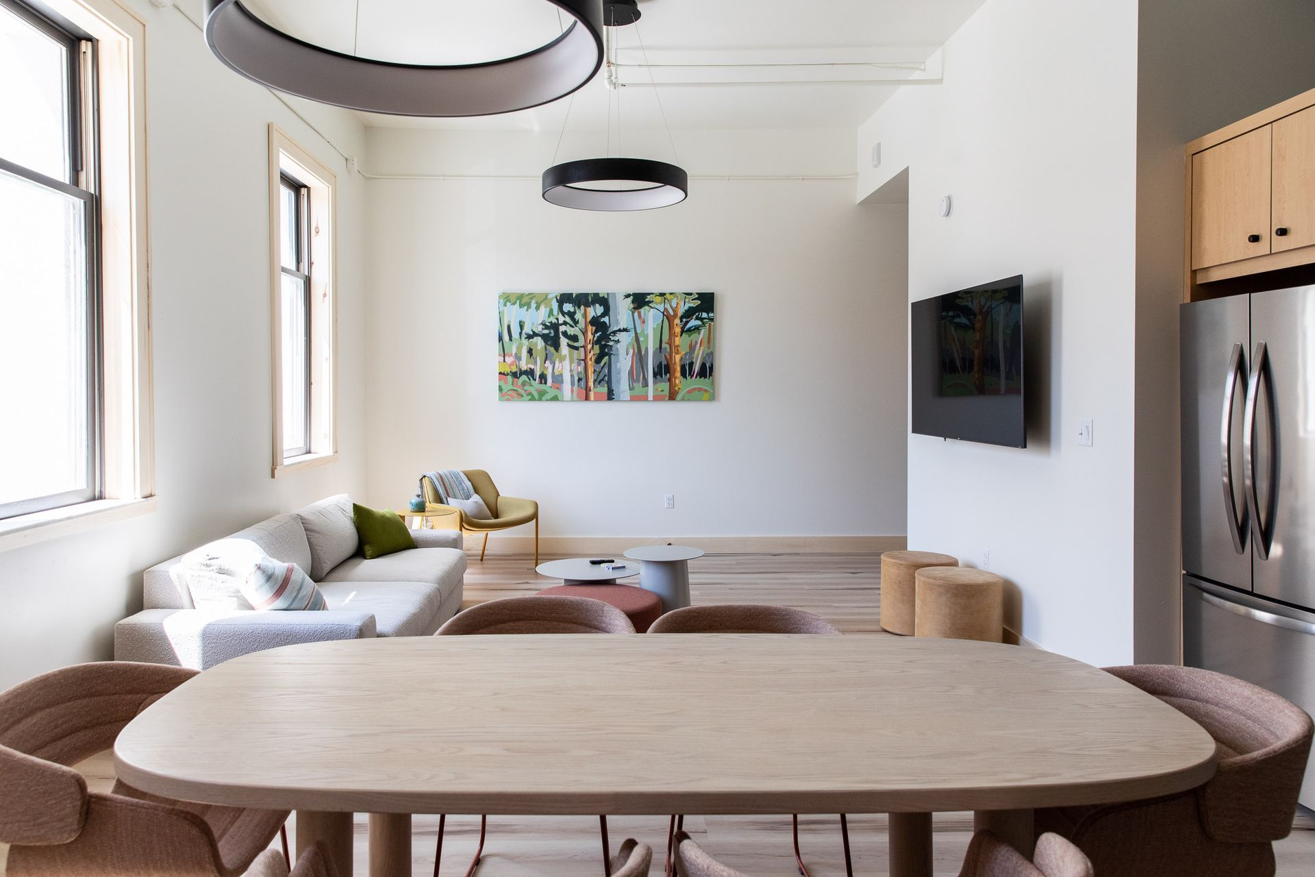 A living room with a table and chairs and a couch.