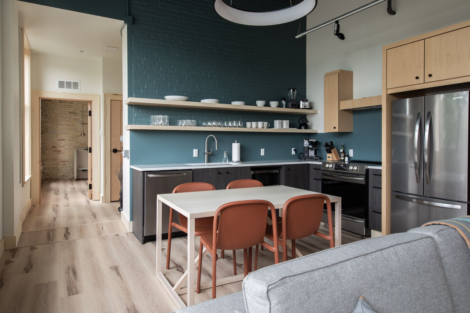 A kitchen with a table and chairs in it