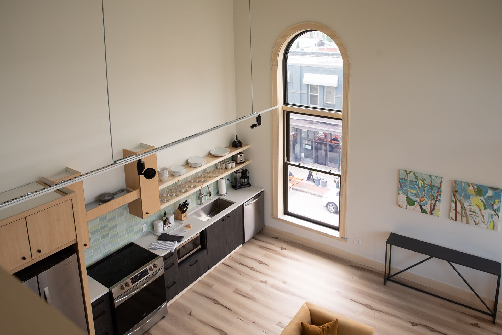 An aerial view of a kitchen with a large window.