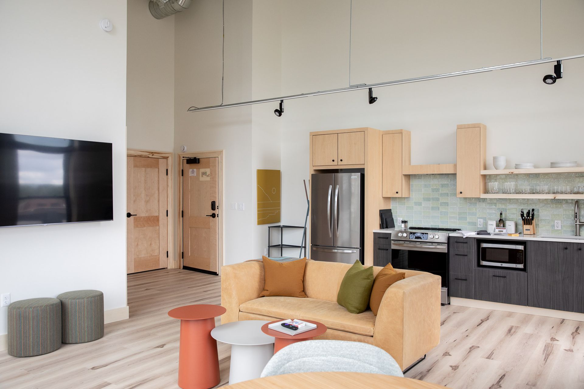 A living room with a couch , table , and television.