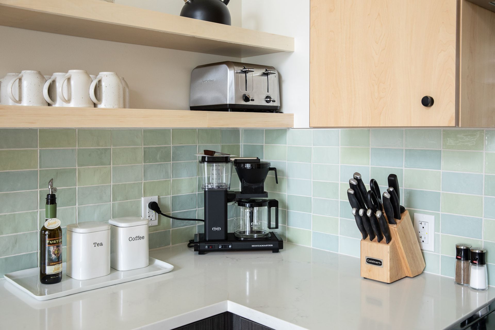 A kitchen counter with a coffee maker