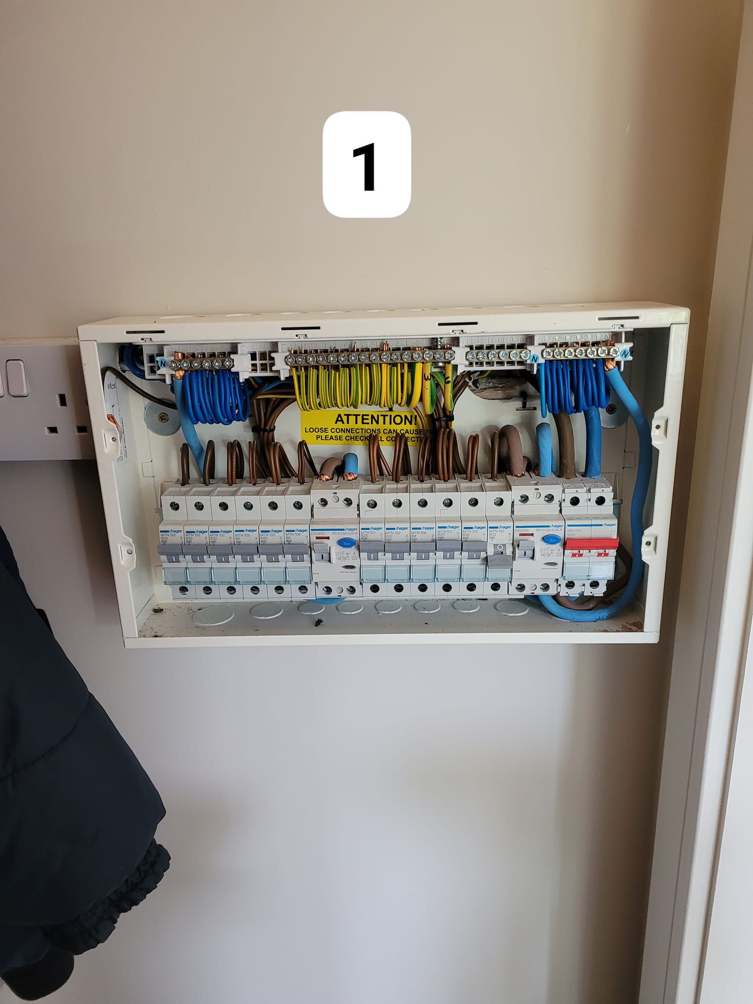 A yellow multimeter is sitting on top of a blueprint.
