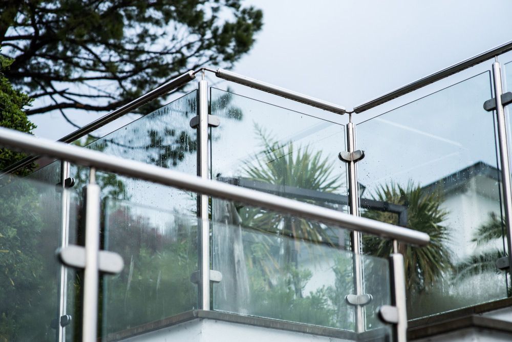 A Balcony With A Glass Railing And A Stainless Steel Railing — Scratchless Glass Australia in Maroochydore, QLD