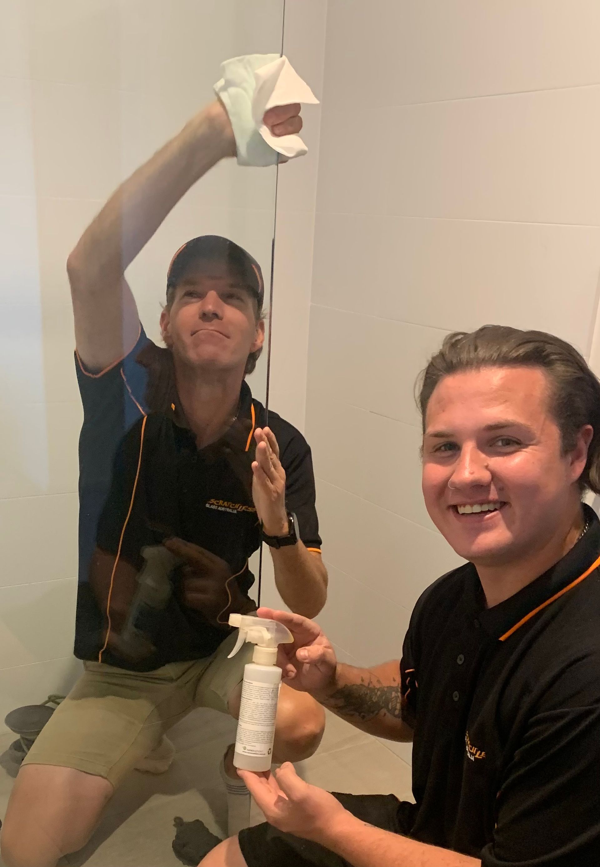 A Bathroom With A Toilet, Sink, Shower And Mirror — Scratchless Glass Australia in Maroochydore, QLD