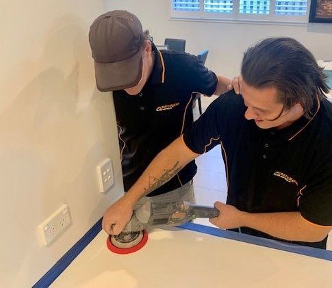 A Lawn Mower Is On Top Of A Concrete Floor — Scratchless Glass Australia in Maroochydore, QLD