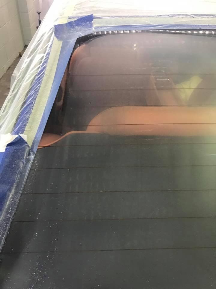 Car Rear Windscreen Inside a Workshop