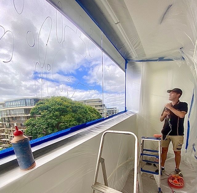 A Glass Railing Is Surrounding A Staircase In A Building — Scratchless Glass Australia in Maroochydore, QLD